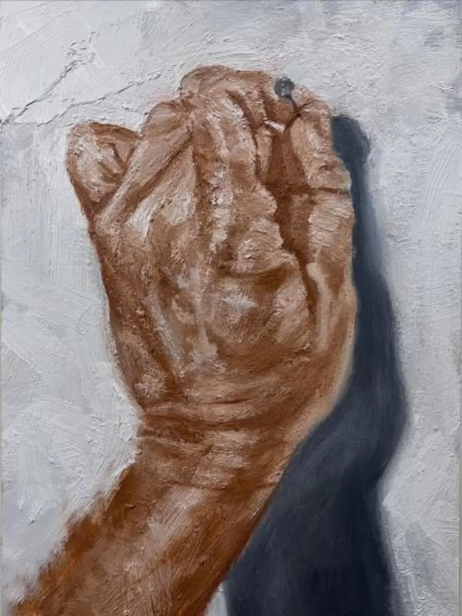 Hand Holding a Nail
